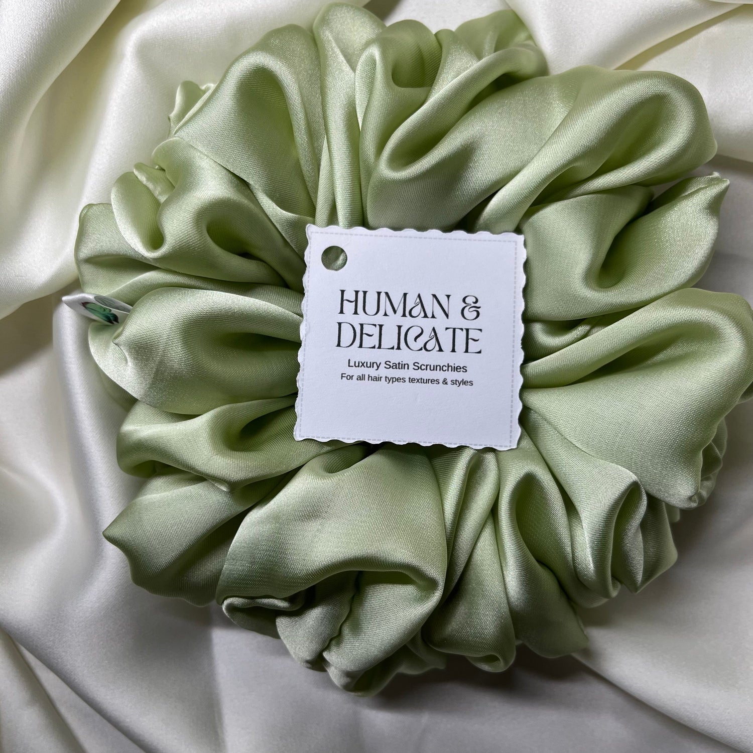 Soft Silky Satin oversized luxury jumbo scrunchie in soft green for all hair types.