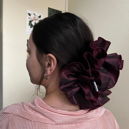 Opulent oversized frilly hair scrunchie, handmade with vintage deadstock John Lewis taffeta, worn over sophisticated low bun.