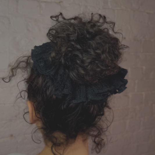 Curly hair frilly ruffled lace trim scrunchie hair accessory.