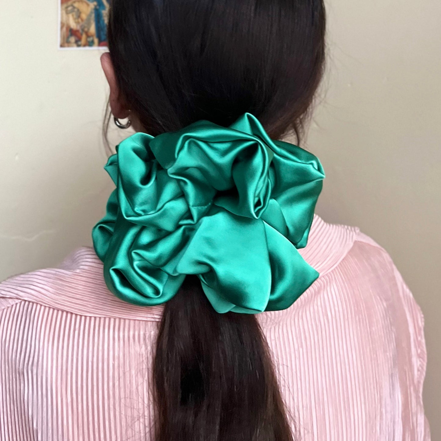 oversized silky premium satin scrunchie with extra hold in lush green adorns pony tail. handmade in nottingham for all hair types.
