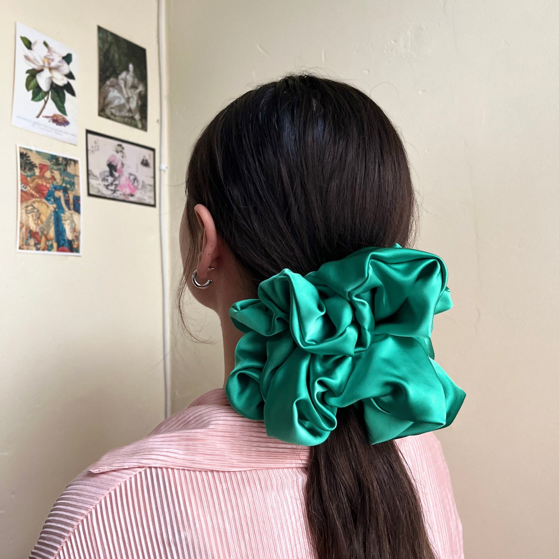 oversized silky premium satin scrunchie in lush green adorns pony tail. handmade in nottingham for all hair types.