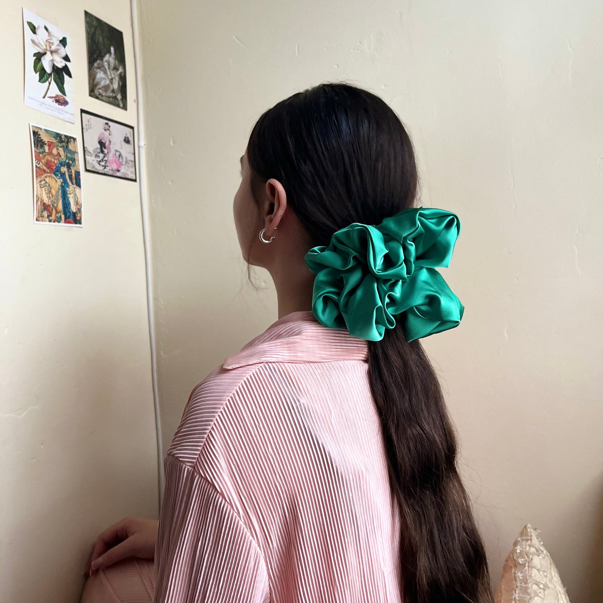 oversized silky premium satin scrunchie with extra hold in lush green adorns pony tail. handmade in nottingham for all hair types.