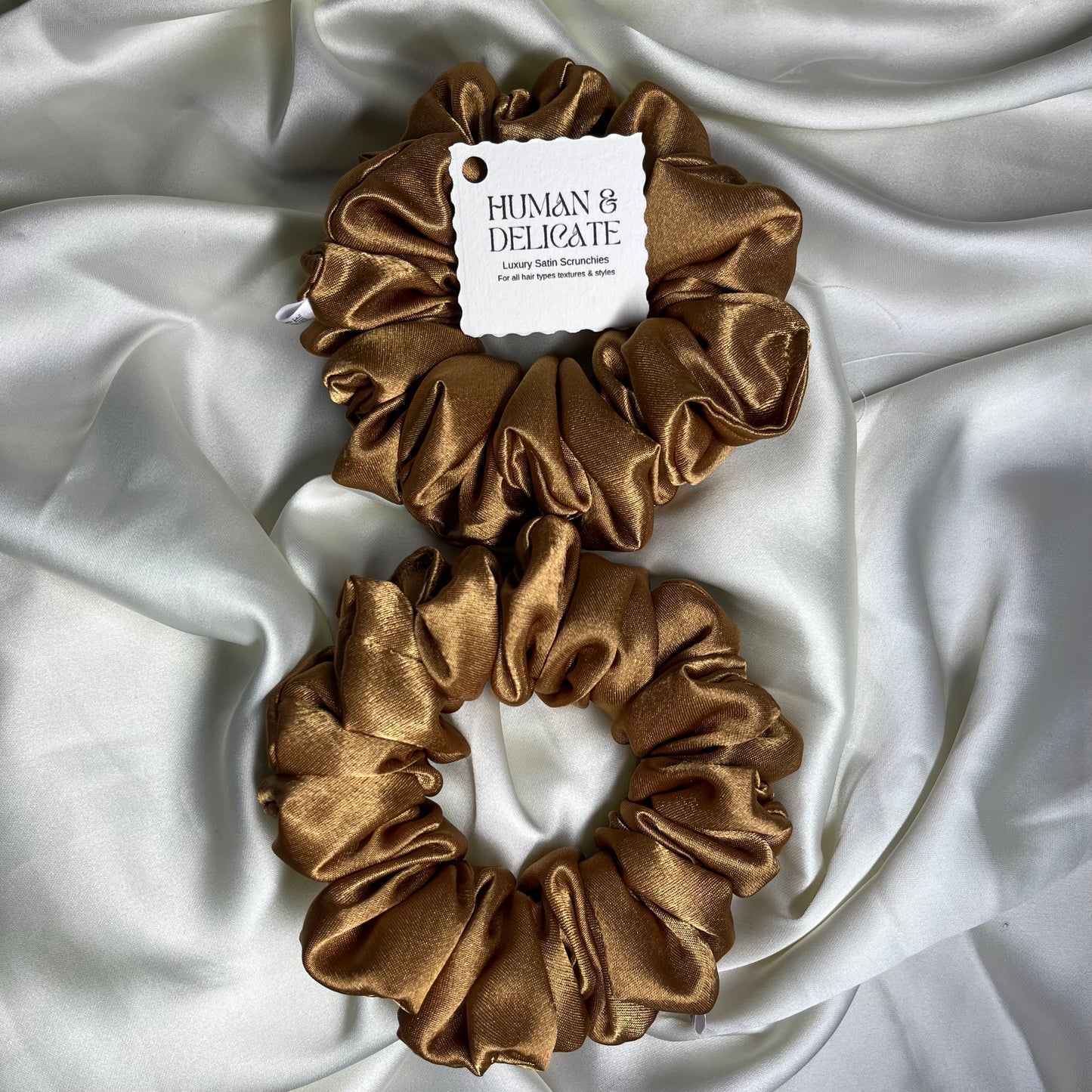 Soft silki mini petite scrunchie made with antique gold high quality luxury satin. Perfect for all hair thicknesses types and textures. Handmade in nottingham with slow and low-waste processes