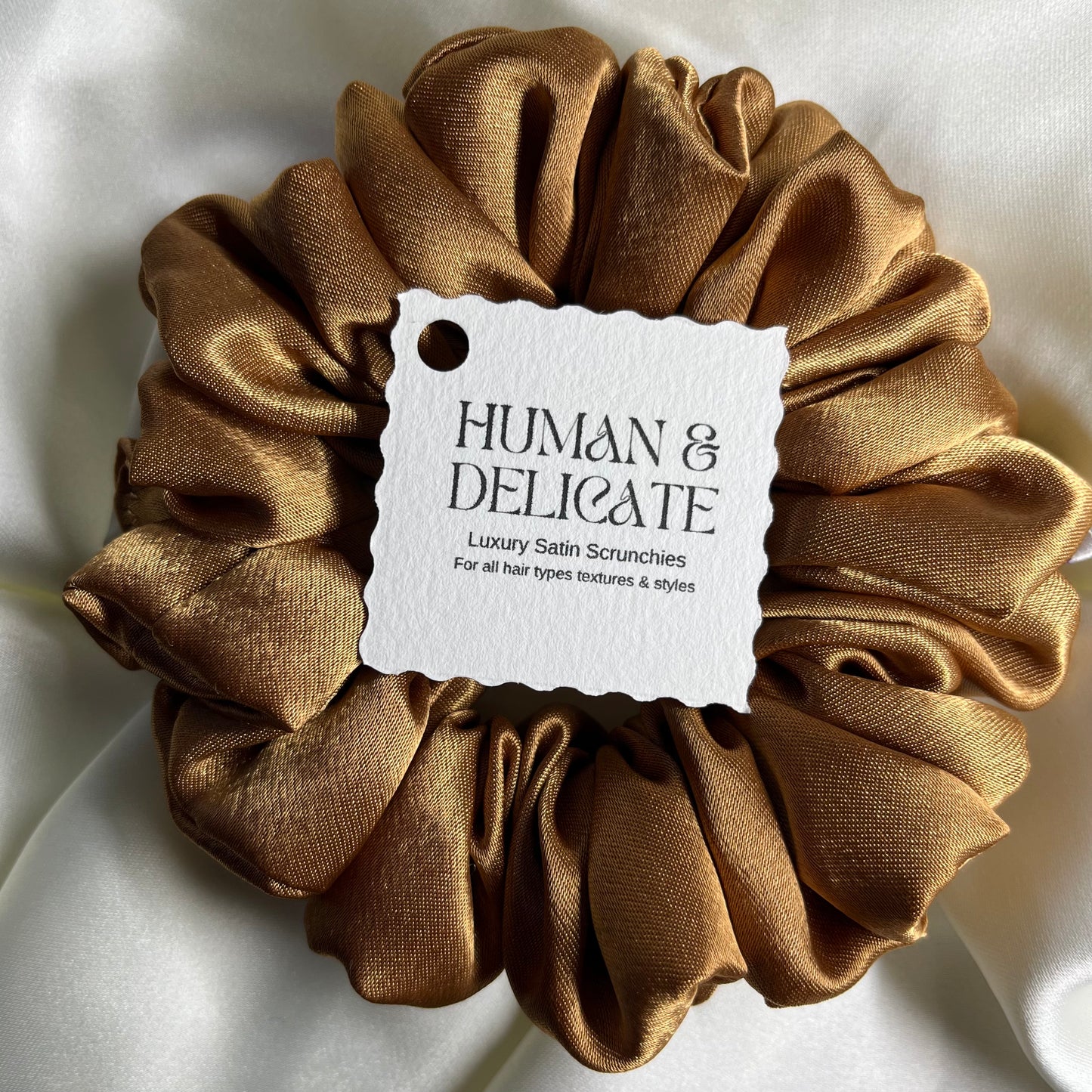 Soft silki mini petite scrunchie made with antique gold high quality luxury satin. Perfect for all hair thicknesses types and textures. Handmade in nottingham with slow and low-waste processes