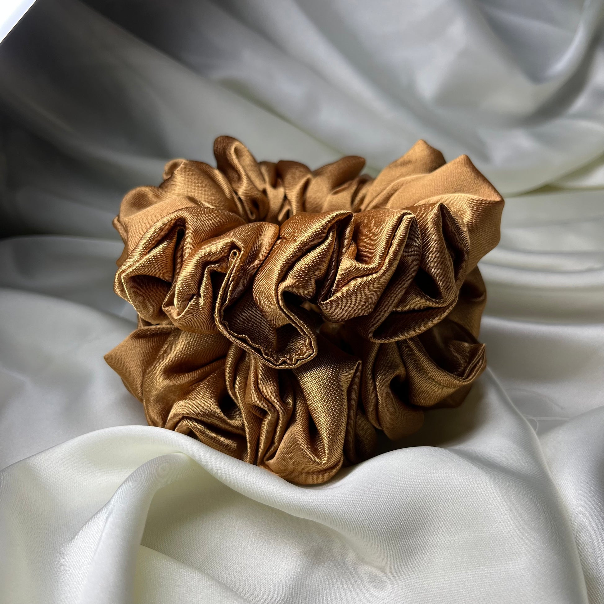 Luxury Soft silki mini petite scrunchie made with antique gold high quality luxury satin. Perfect for all hair thicknesses types and textures. Handmade in nottingham with slow and low-waste processes