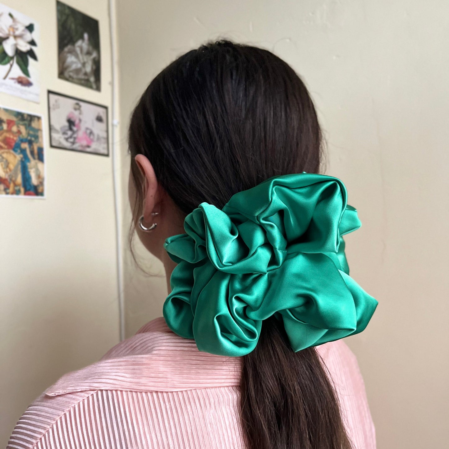 oversized silky premium satin scrunchie with extra hold in lush green adorns pony tail. handmade in nottingham for all hair types.
