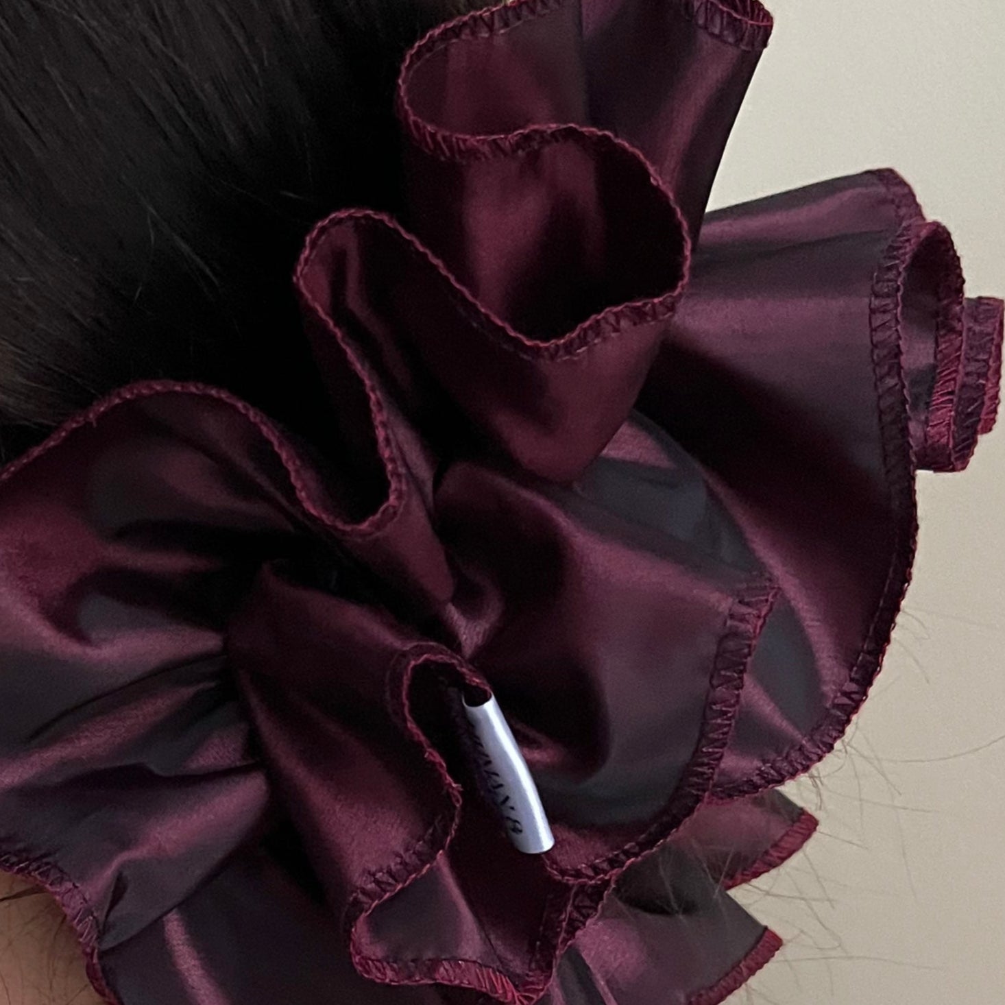 Opulent oversized frilly hair scrunchie, handmade with remnant vintage deadstock John Lewis taffeta, worn over sophisticated low bun.